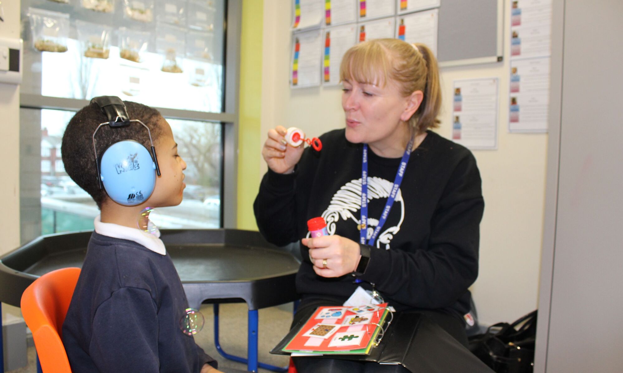 Prospect House Primary School - Teacher and pupil in class